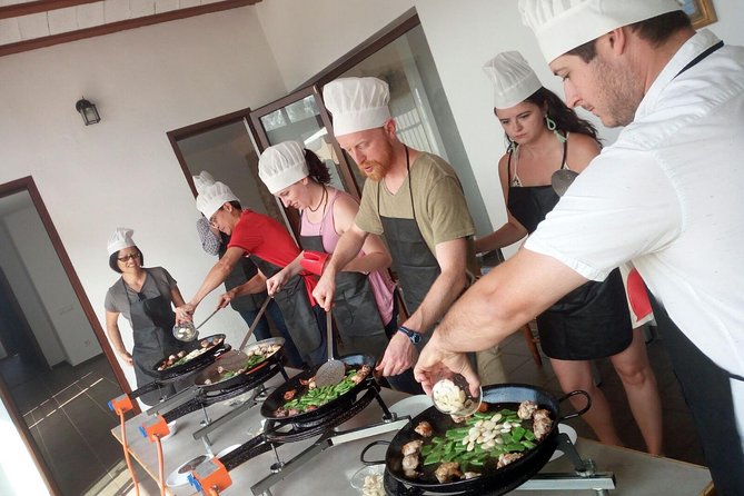 Authentic Valencian Paella Cooking Class - Eating the fruit-and-sweet-wine finale you helped make