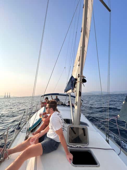 Barcelona Badalona : Sailboat Tour, Snacks, Drinks, Swimming - From deck to skyline with binoculars and the SUP option