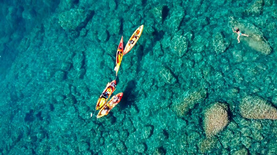 Barcelona: Costa Brava Kayak, Snorkel & Cliff Jump & Lunch - Paddling the Costa Brava coastline: caves, coves, and why double kayaks are a big deal