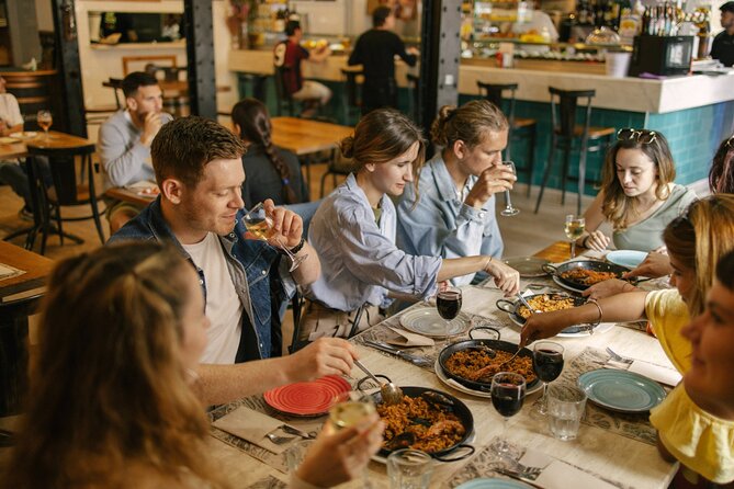 Barcelona: Guided Food Walking Tour with Tapas and Wine - Carrer dels Banys Vells and El Born: Alleyways and Shopfront Windows