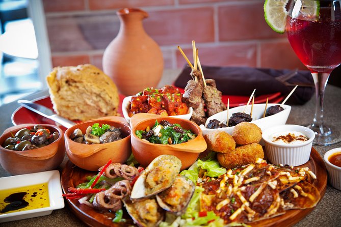 Barcelona Old Town Night Small Group Tour with Tapas & Flamenco - Las Ramblas stop: tapas, menu tips, and what you actually taste