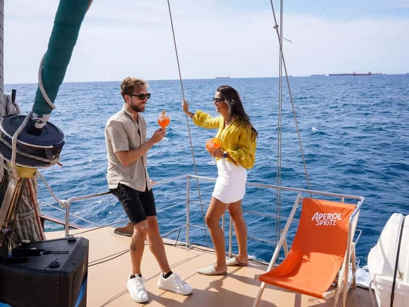Barcelona: Wooden Boat Sailing with Tapa and Welcome Drink - Choosing Your Spot Onboard: Rooftop, Interior Lounge, Aft Chill