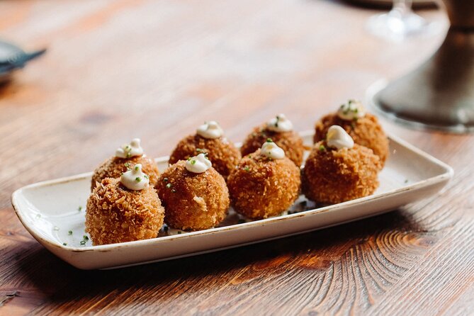 Bohemian Barcelona Neighborhood Evening Tapas & Wine Tour - Stop 3: Bastaix where classic Barcelona meets Argentine flair