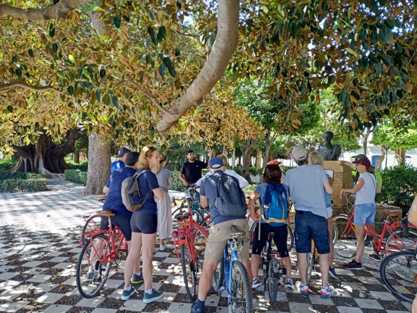 Cadiz: City Bike Tour - Getting on the orange bikes at Calle Sagasta