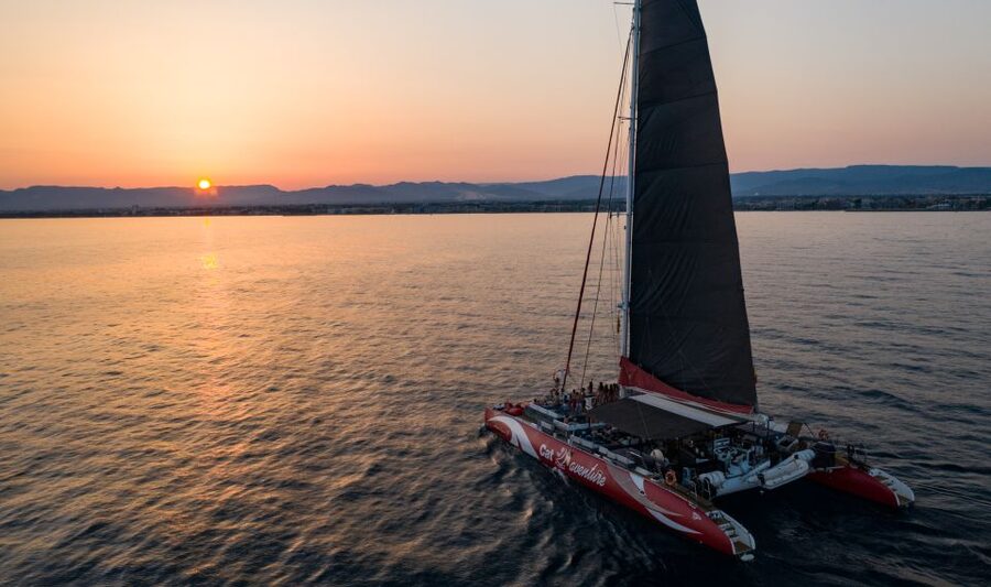 Cambrils: Sunset Catamaran Cruise with Drinks - The onboard setup: comfy sunbeds, shoes off, and a drinks-first vibe
