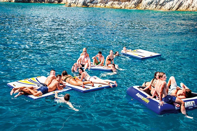 Catamaran ride -Costa Brava with barbecue and drinks. Familiar. - The One-Hour Navigation Break, Then Your Sheltered Cove Swim