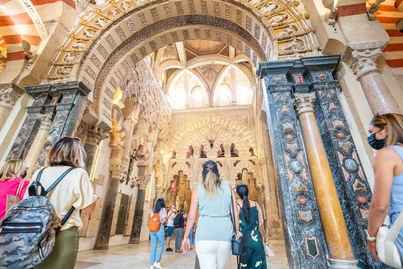 Córdoba: Mosque, Jewish Quarter & Tour with Ticket - Inside the Mosque-Cathedral: Patio de los Naranjos, arches, and the Mihrab