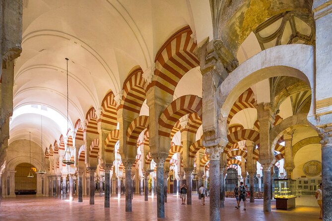 Cordoba Tour with Mosque, Synagogue and Patios from Malaga - La Juderia Walk: Navigating the Jewish Quarter Streets