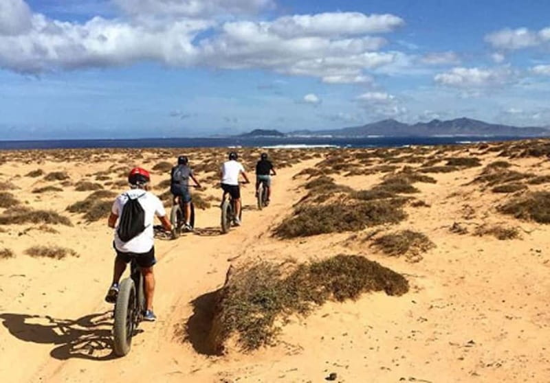 From Corralejo: Fuerteventura Guided E-Bike/E-scooter Tour - North Volcanic Chain: Bayuyo and Calderon Hondo in one morning