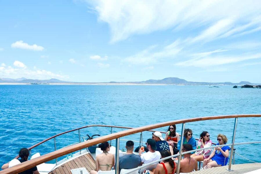 From Corralejo: Lobos Island Boat and Snorkel Activity - Boarding the Majorero: drink, views, and that quick island cruise