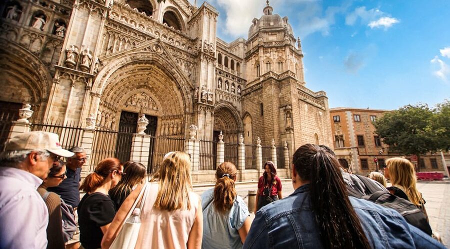 From Madrid: Guided Day Trip to Toledo by Bus - The 60-minute guided walk: cobblestones, squares, and bilingual storytelling