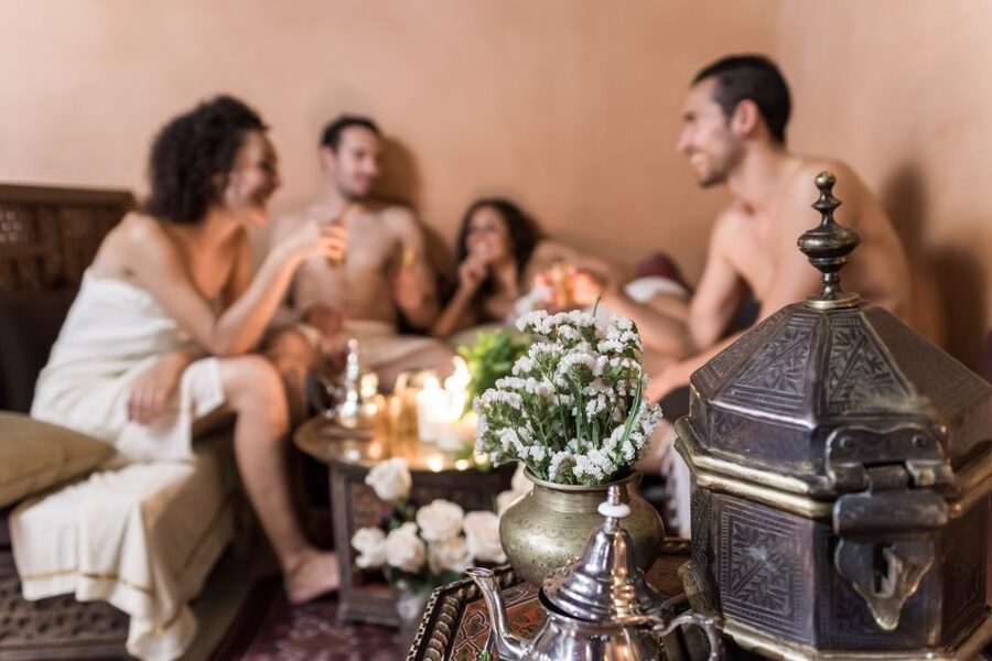 From Malaga: Hammam Bath, Kessa and Relaxing Massage Tour - The kessa scrub: black soap cream, cotton glove, and a hot stone table