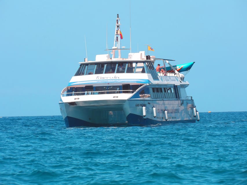 From Puerto Rico: Boat trip along the coast w/ Food & Drinks - Stop 2 near Mogán: banana boat ride and more fun on the water