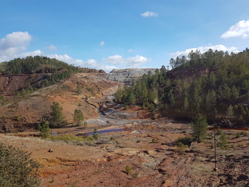 From Seville: Full-Day Aracena & Rio Tinto Mines Tour - Gruta de las Maravillas cave: stalactites, stalagmites, and deep blue water
