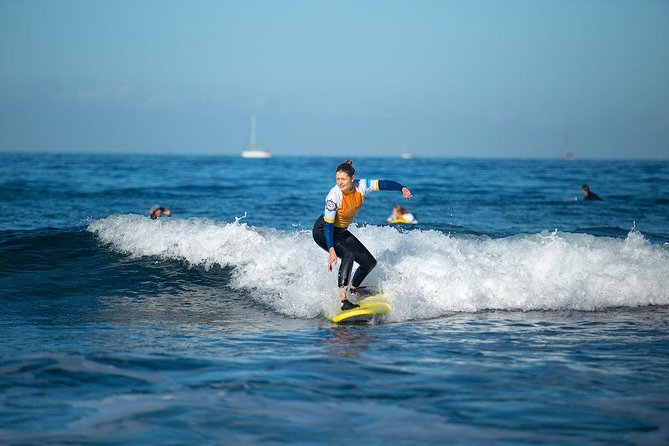 Group Surf Lessons - The 2-hour flow: warm up, then get in the water