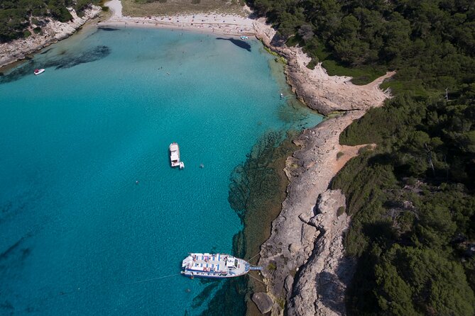 Half-Day Boat Tour along The South Coast of Menorca - Onboard comfort, glass-bottom viewing, and the swim-stop extras