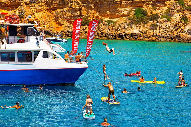 Ibiza Beach Hopping Cruise with Paddleboards, Drinks and Food 6h - The vibe: lively catamaran, not a party-only boat