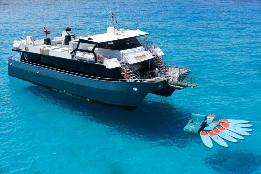 Ibiza: Formentera Cruise at Ibiza Boat Club - The evening swim stop at Formentera: SUP, giant slide, and real playtime