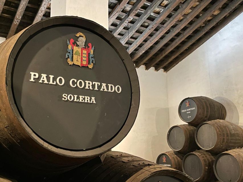 Jerez de la Frontera: Sherry Winery Tour with Tasting - Barrel room time and the label exposition in the 1886 winery
