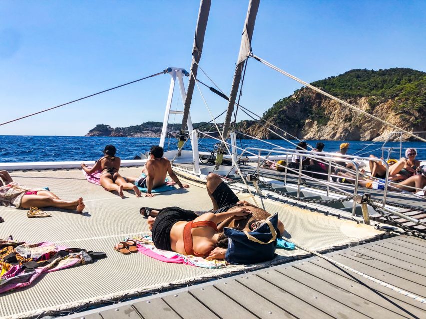 Lloret de Mar: Catamaran Sailing Cruise with BBQ and Drinks - The anchor stop is the real highlight: trampoline, floating mattress, snorkeling time