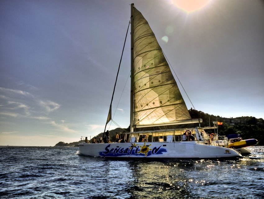 Lloret de Mar: Sunset Catamaran Cruise with DJ and Drinks - Getting Started: Passeig dAgustí Font and Check-In Timing