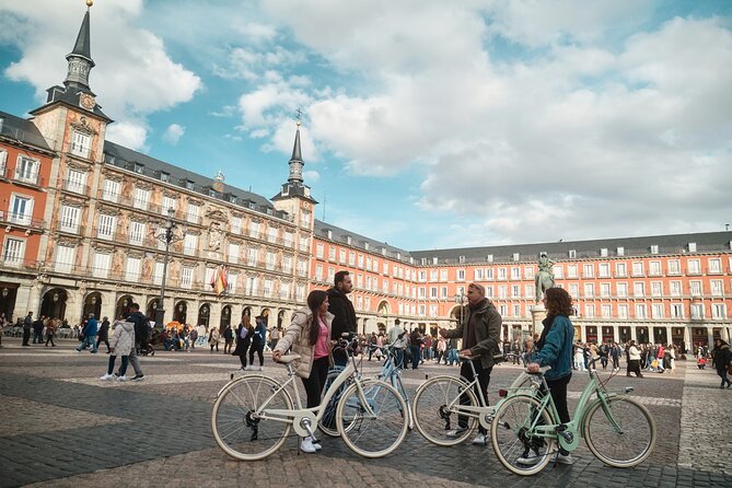 Madrid: City Highlights Guided Vintage Bike Tour - The main street stretch: palaces, museums, shops, and money