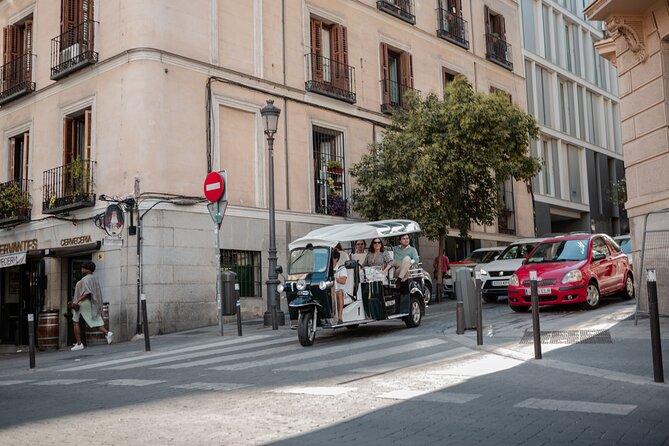 Madrid Historical Tour with Local Guide in Eco Tuk Tuk Private - Your guide experience in English, with stops timed for photos