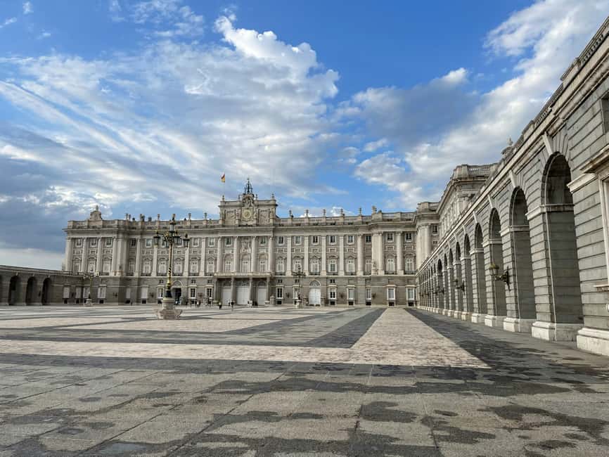 Madrid: Royal Palace Skip-the-Line Entry with Audio Guide - Plaza de España meeting point, ticket pickup, and what that means
