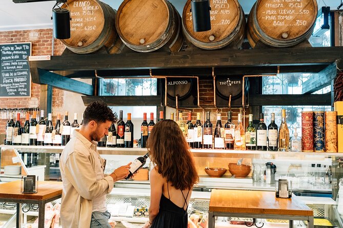 Madrid Tapas & Wine Tour with Rooftop Views and Local Guide - Stop 2: Plaza Mayor and the Ham-and-Wine Moment