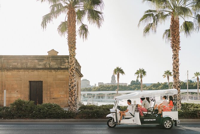 Malaga Welcome Tour with Local Guide in Eco Tuk Tuk Private - University of Malaga, Bank Branch, and Town Hall: The City Beyond Tourism