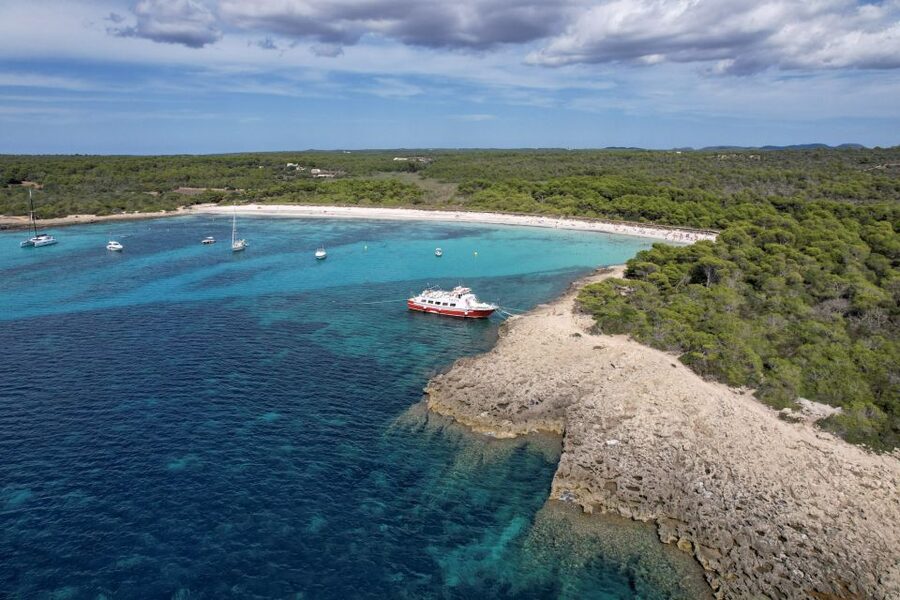 Menorca: Full-Day Boat Tour with Paella Lunch - Onboard Life: Guide, Music, Drinks for Sale, and How the Day Feels