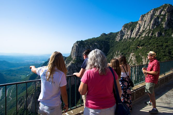 Montserrat & Winery Visit Tour with Traditional Farmhouse Lunch - Penedes wine country: vineyards, underground cellars, and Cava context