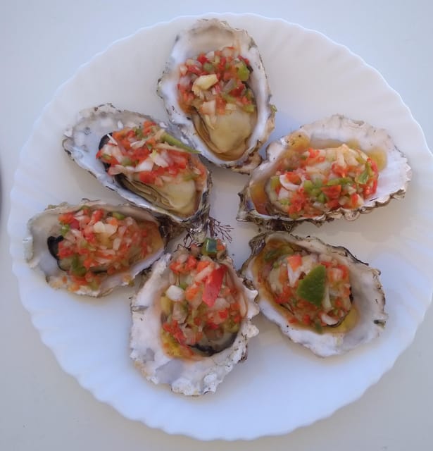 O Grove: Ría de Arousa Catamaran Tour with Seafood Lunch - Lunch on the Move: Steamed Mussels, Oysters, Shellfish Rice, and Melon