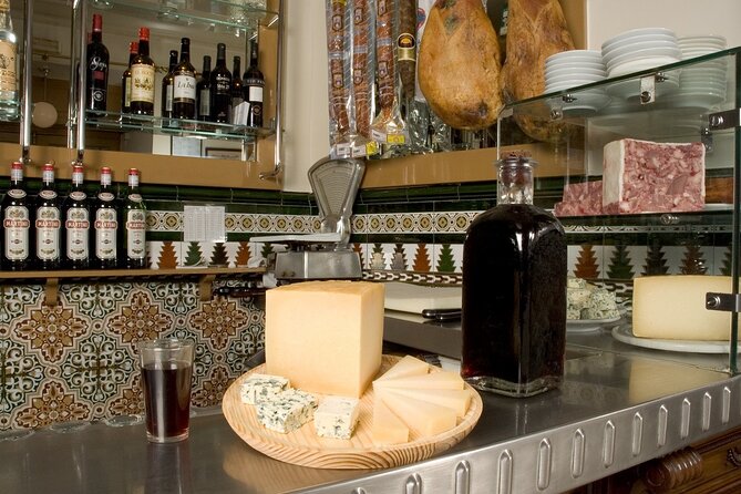 Old Madrid Tapas and Fine Wine Small Group Tour - Bar two: wine the 19th-century way, then Madrid cod fritters