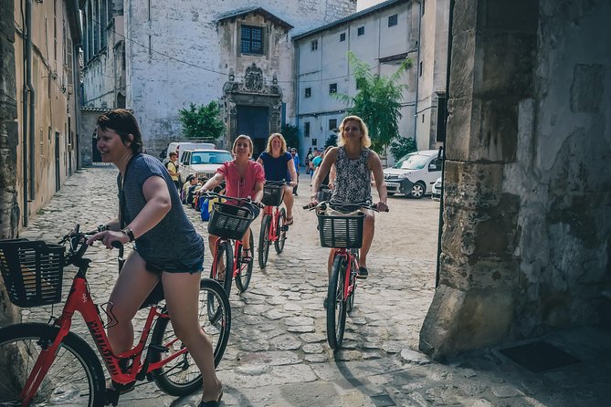 Palma de Mallorca Bike Tour with tapas - Basilica facades and story stops you can’t get from a postcard
