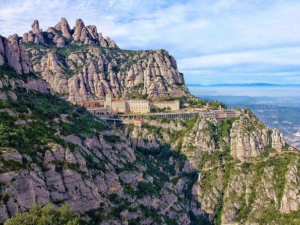 Panoramic Barcelona and Montserrat with Cog-Wheel Train - Montjuïc cable car and the Olympic-era viewpoints you will actually remember