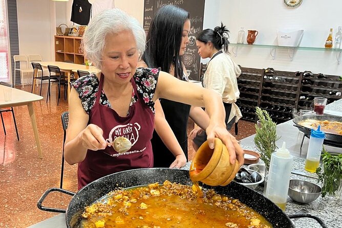 Seafood paella cooking class, tapas and visit to Ruzafa market. - Seafood Paella Cooking, Step by Step at the Pan