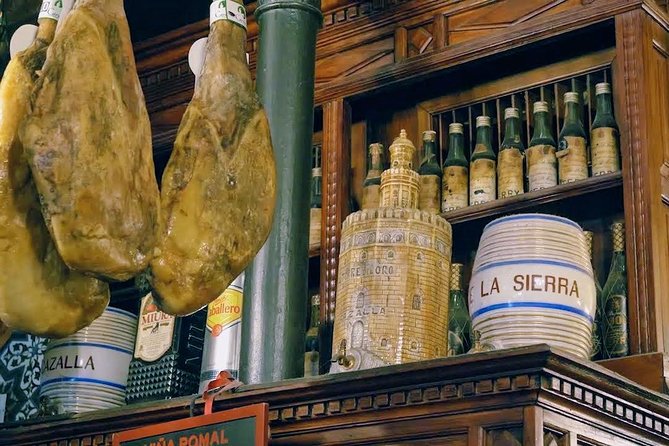 Sevilla Food Tour: Tapas, Wine, History & Traditions - Plaza del Pan and the Traje de Flamenca Moment