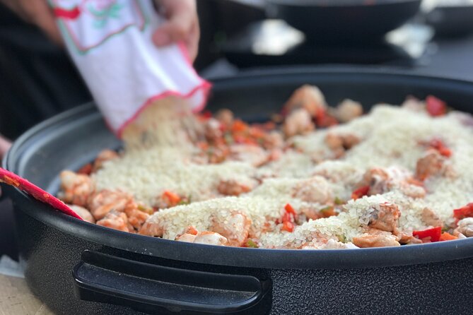 Sevilla: Rooftop Paella Cooking Class & 30-minute expert Q&A - From Columnas Romanas to the Rooftop: How the Night Starts
