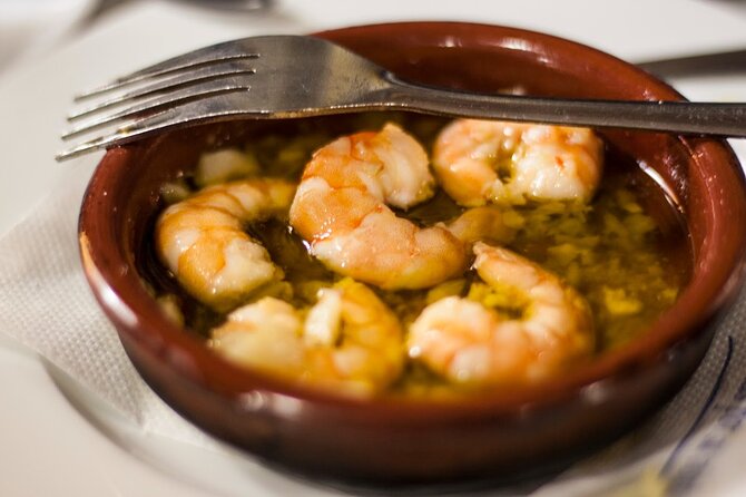 Seville Food Tour: Vermut, Churros & 10+ Tasty Local Dishes - Seville Cathedral bell tower: from minaret to landmark