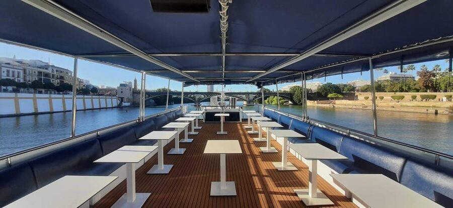Seville: Guadalquivir Boat Tour with Optional Lunch/Dinner - 1.5-hour cruise: Iberian ham tapa, Manchego, and one drink