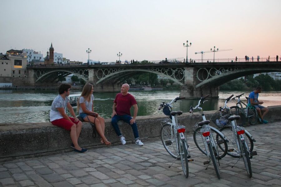 Seville: Guided Sunset Bike Tour - Torre del Oro and the river view payoff