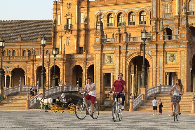 Sunset Guided Bike Tour in Seville - Torre del Oro and Giralda: river control and the minaret-to-bell-tower story