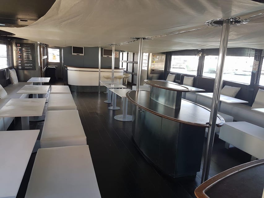Valencia: Catamaran Cruise, Paella Lunch and Swim Stop - Drinks, Music, and the Onboard Feel