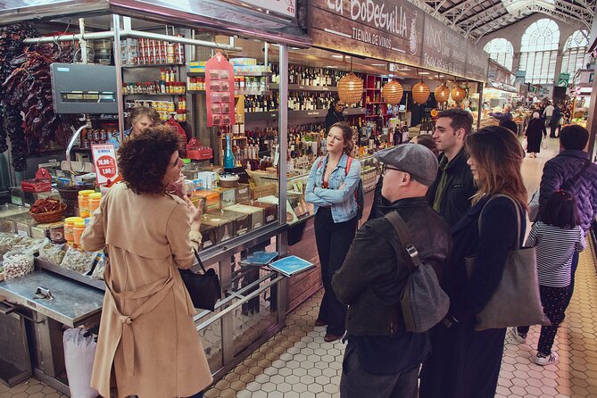 Valencia's Greatest Food, History & Culture Tour - Mercat Central de Valencia, ham, and cheese in a market that feels like a landmark